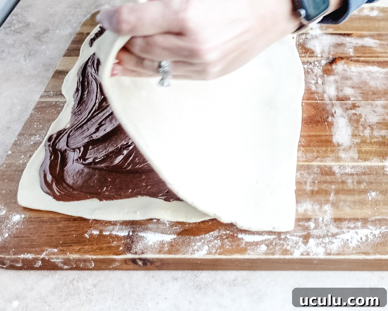 Top with the second sheet of puff pastry.