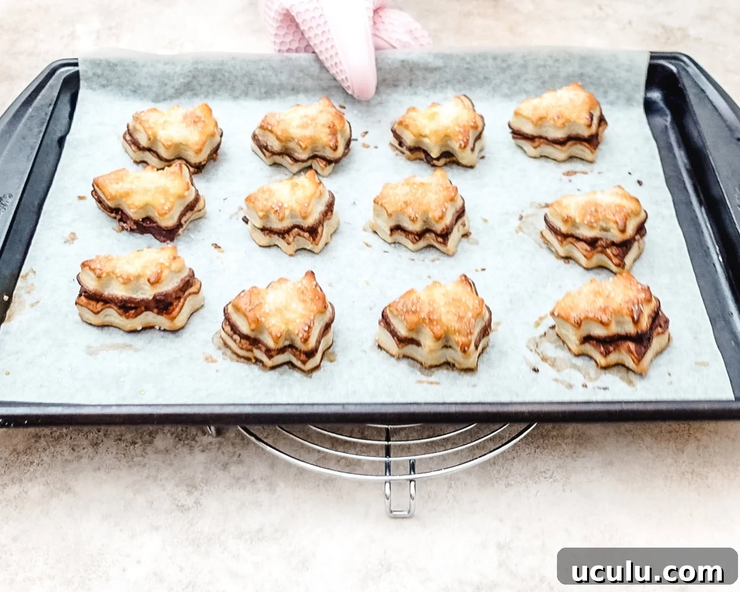 Baked puff pastry Christmas trees with Nutella filling.