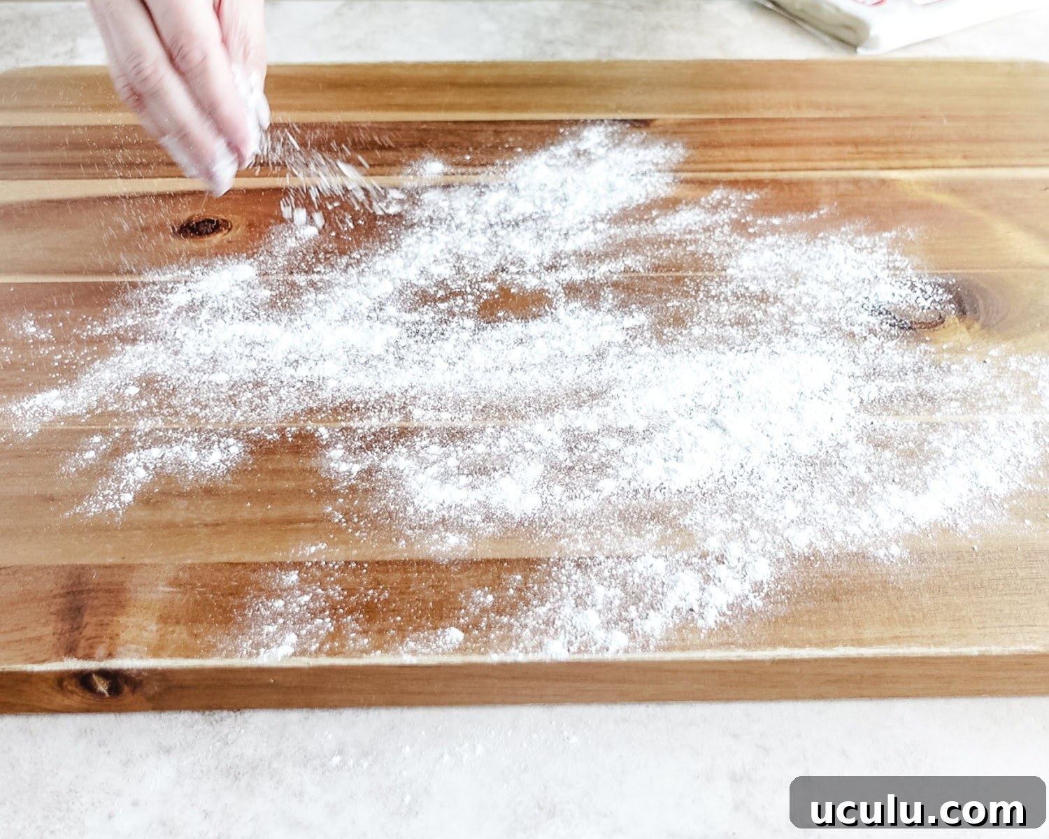 Flour a clean work surface before rolling out your puff pasty sheets.