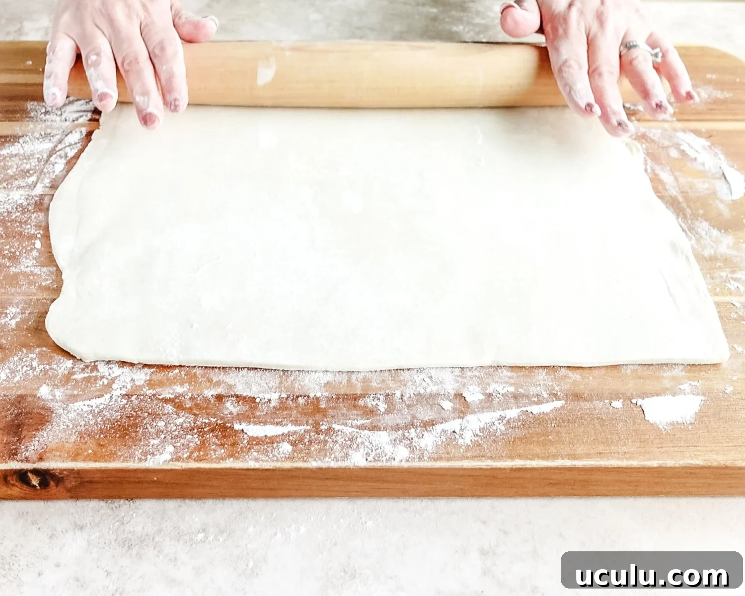 Roll out puff pastry until almost doubled in size.