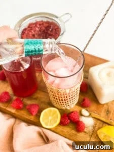 Tonic water being poured into cup