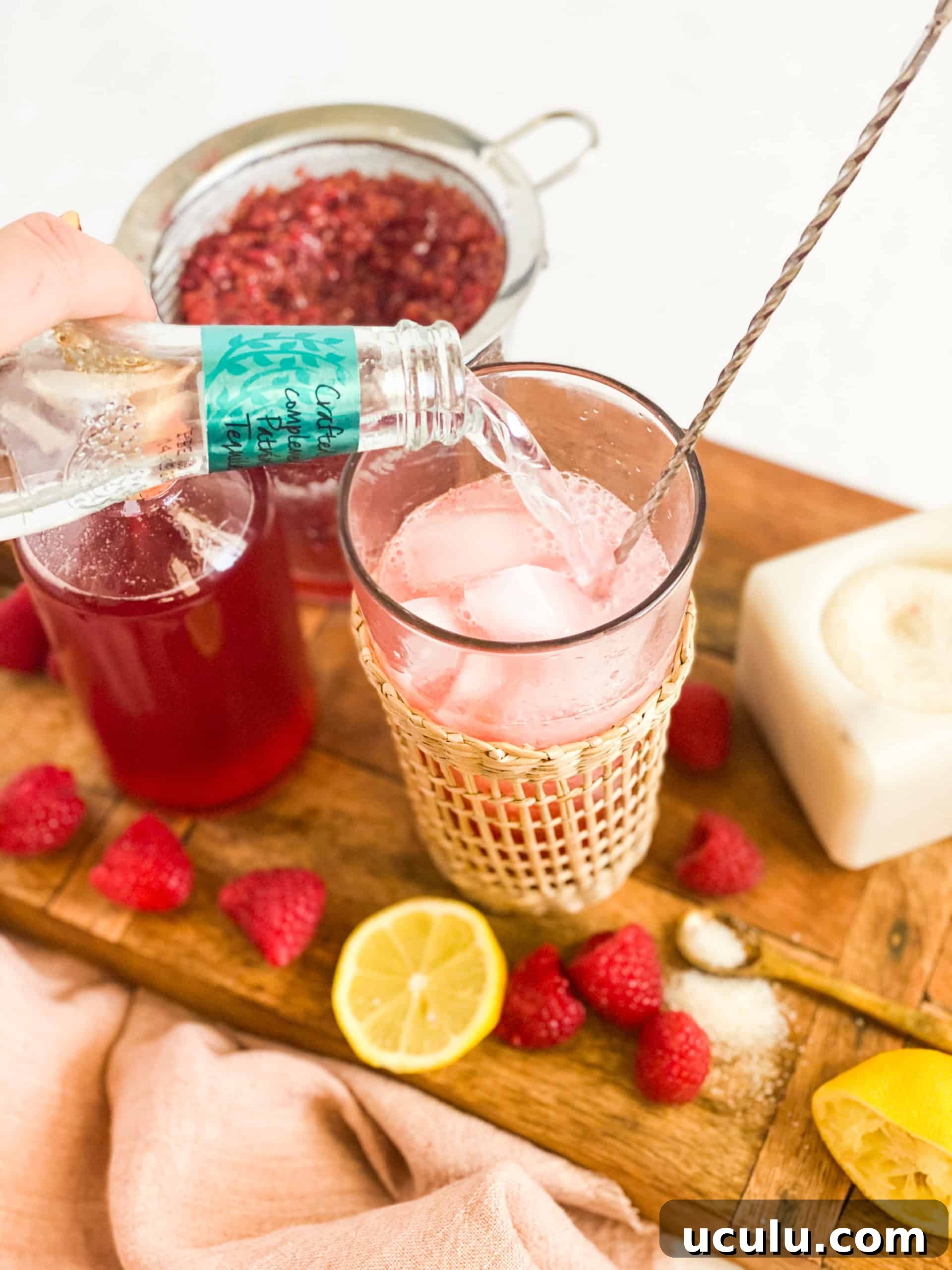 Tonic water being poured into cup