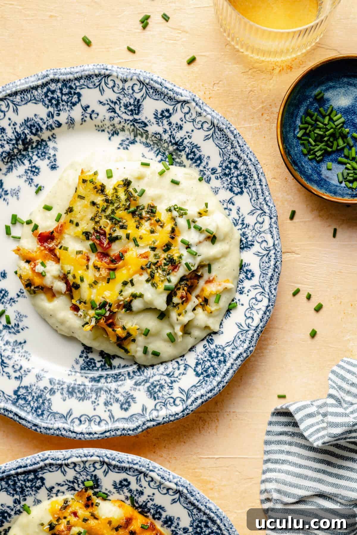 GoGo’s Party Potatoes plated on blue and white plate.