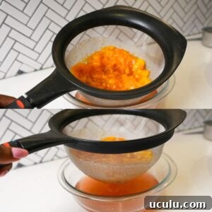 Peach syrup being strained into a bowl.