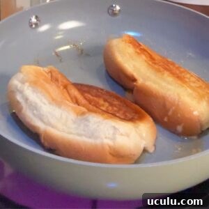 Buns being toasted for lobster rolls.