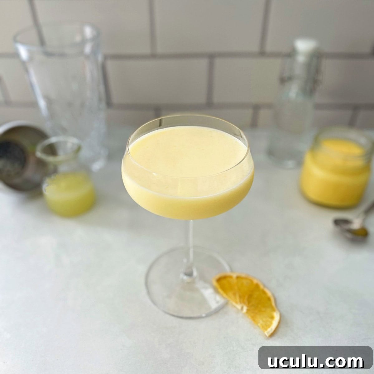lemon curd martini in a coupe glass.