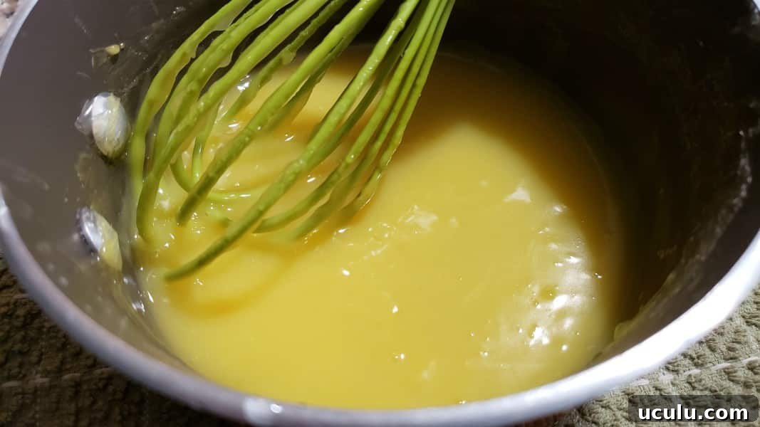 lemon pie filling from scratch cooking in a pan
