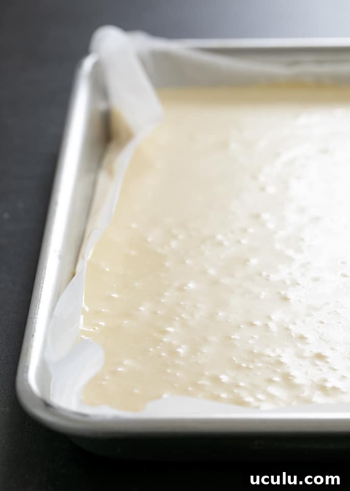 Raw batter for gluten free pancakes made in a sheet pan.