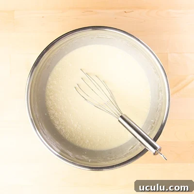 Sheet pan pancake batter whisked in bowl