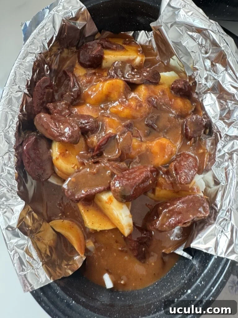 The chili pepper sauce with onions in the black speckled roaster