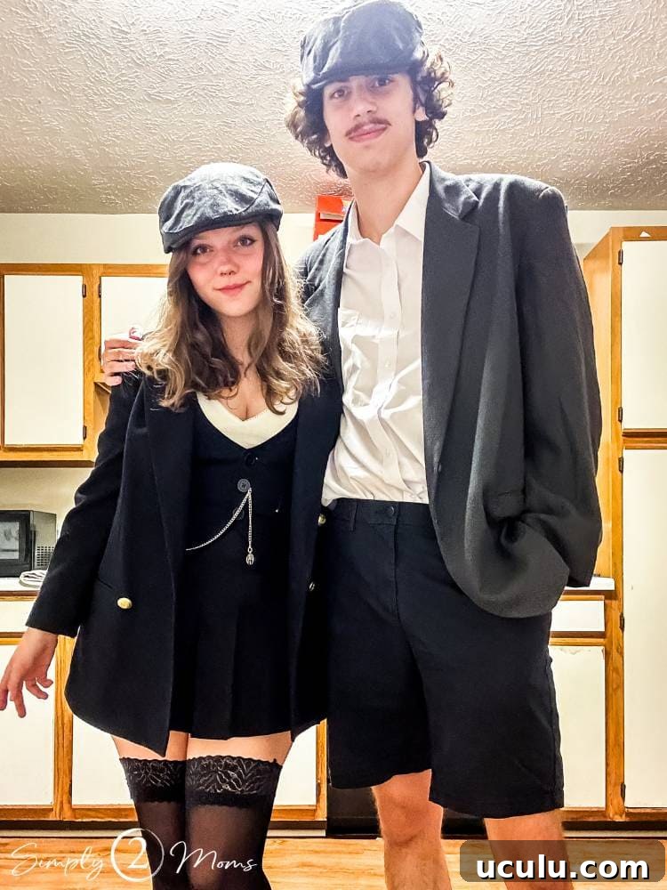 college students standing in kitchen dressed as Peaky Blinders for Halloween