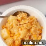 Pineapple casserole in a white dish.