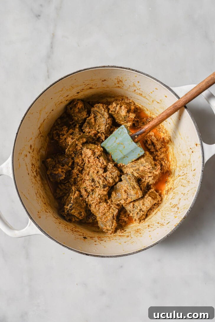 Yogurt and fried onions mixed into browned mutton and cooked.