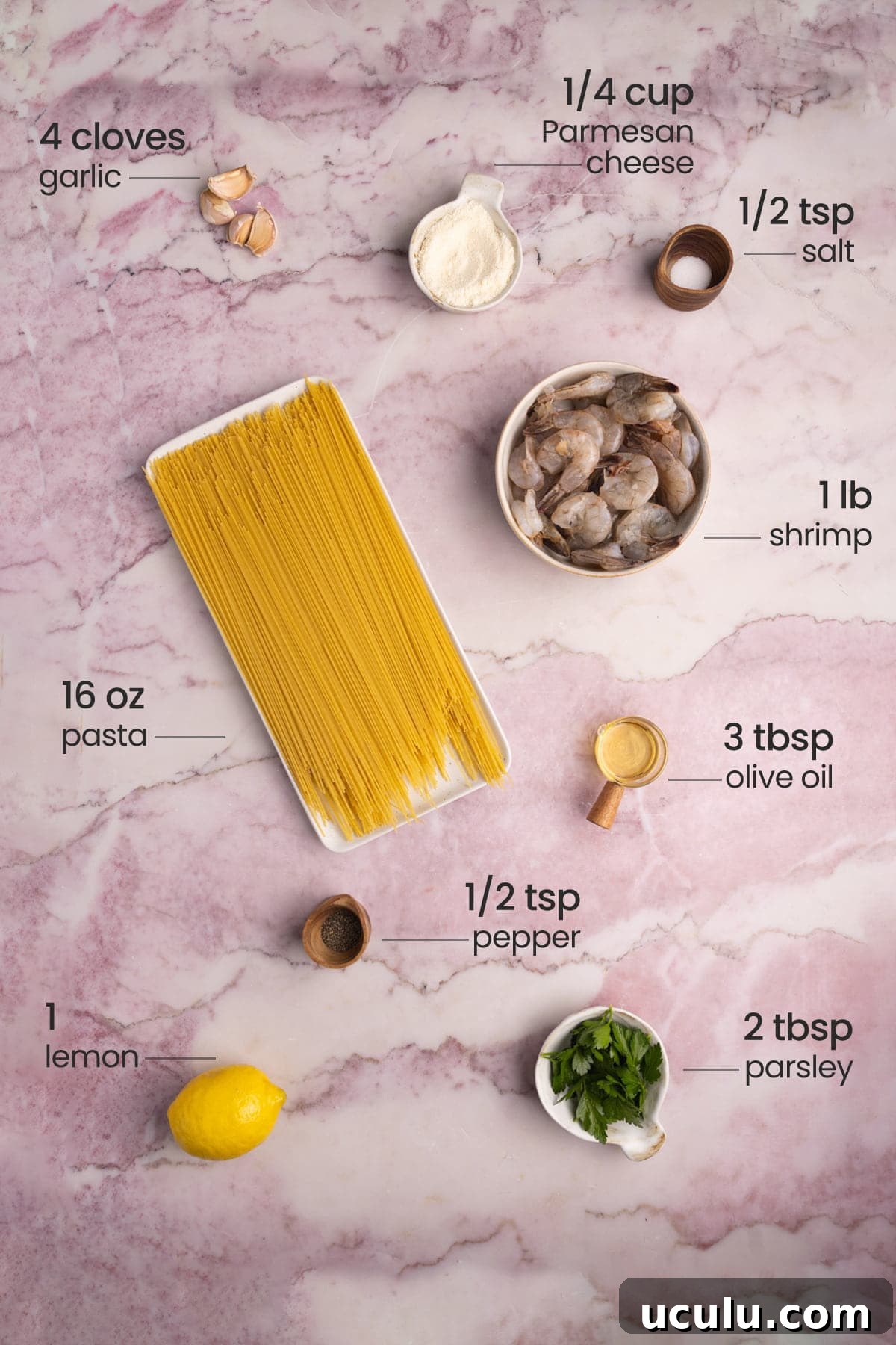 ingredients for lemon shrimp pasta - parmesan cheese, garlic, salt, shrimp, pasta, olive oil, pepper, lemon, parsley