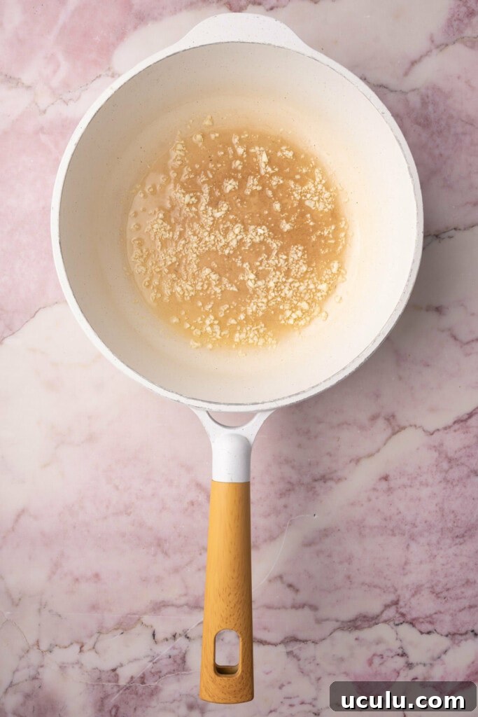 Cooking garlic in hot oil over medium heat. 