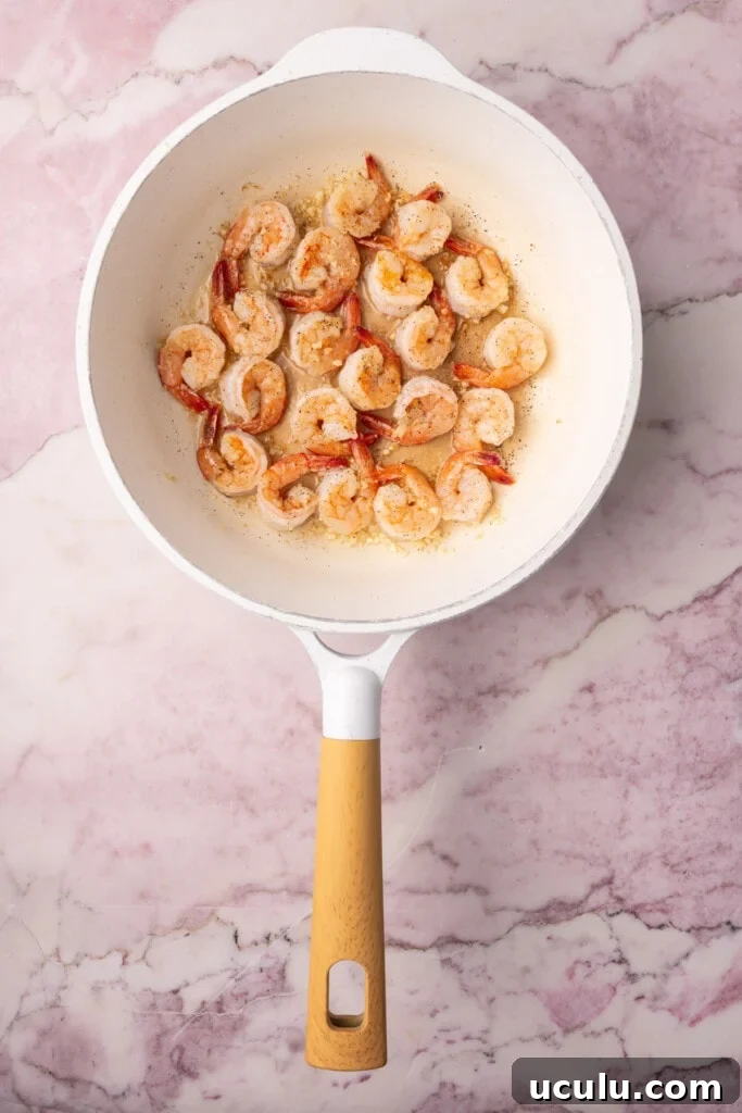 Pan-fried shrimp cooked in a pan with garlic, salt, and pepper. 