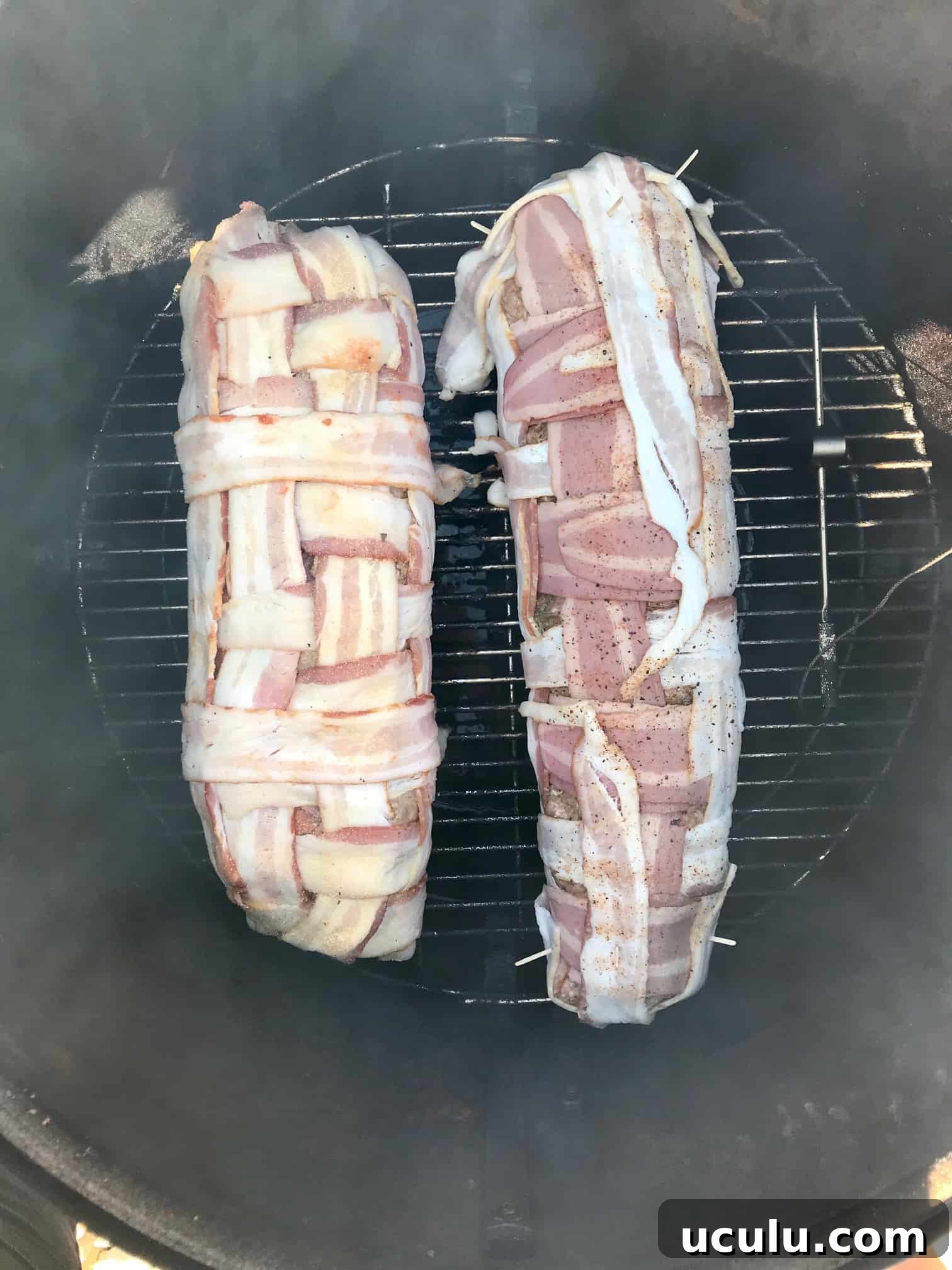 Two bacon explosions on weber grill overhead shot