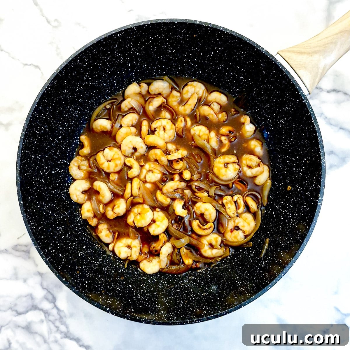 Prawns and cashews added to the sauce.