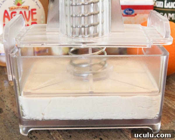 Tofu being pressed