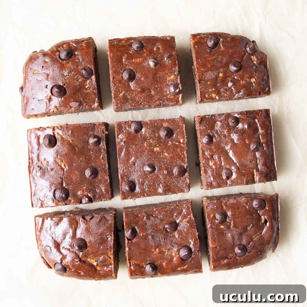 Close up of chocolate zucchini brownies cut into squares. 
