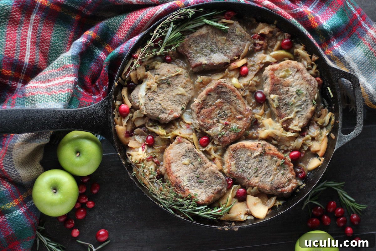 Apple Cranberry Skillet Pork Chops (AIP, Paleo) - this delicious and easy pork dish features sweet apples, tart cranberries, savory onions and cabbage! | fedandfulfilled.com