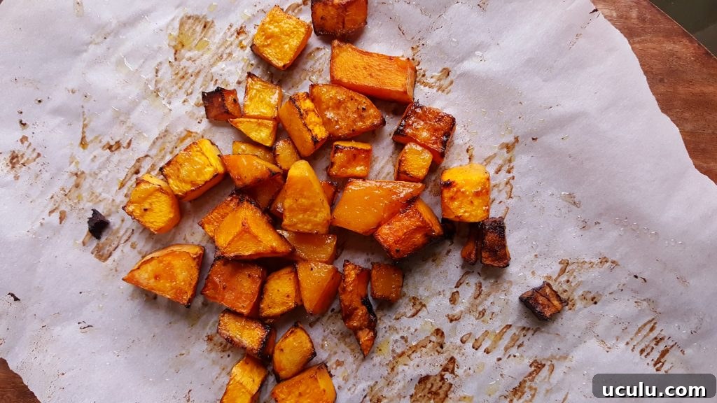 roasted butternut squash on rimmed baking sheet