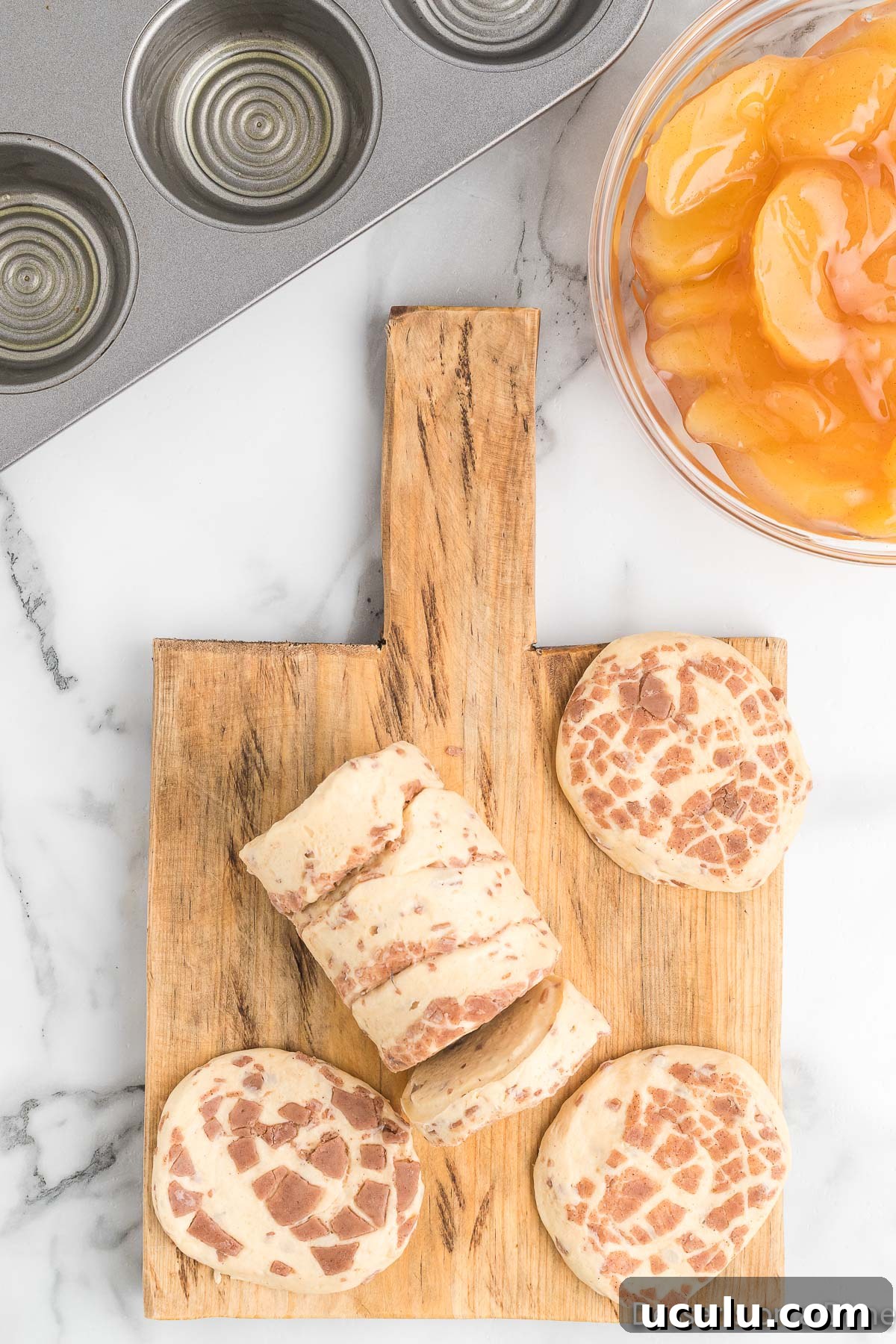 Cinnamon rolls on cutting board.