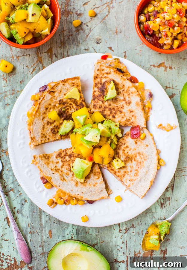 Lightened Up Corn and Bean Quesadillas with Avocado-Mango-Chipotle Salsa (vegetarian/vegan option) - You don't have to derail your diet to enjoy hearty & satisfying comfort food! This version is only about 300 calories & ready in 15 minutes!