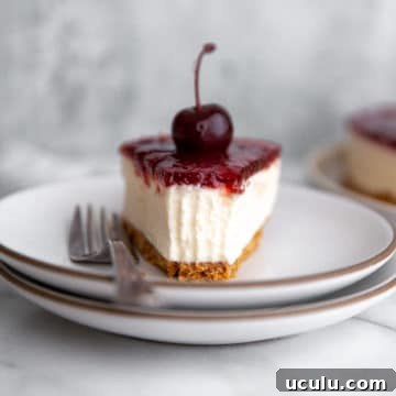 Close-up of a slice of no-bake mascarpone cheesecake on a plate with a fork.