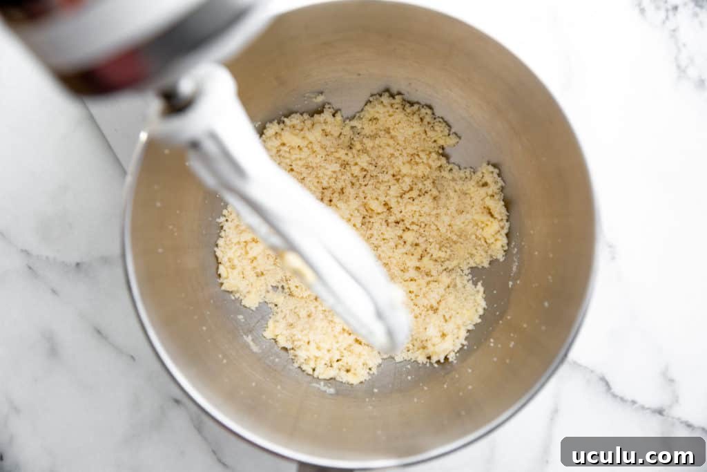 Process shot showing butter and sugar in a stand mixer after they've been beaten together.