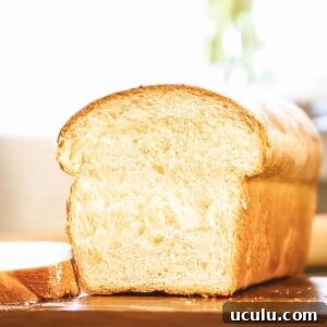 sliced loaf of white sourdough sandwich bread.