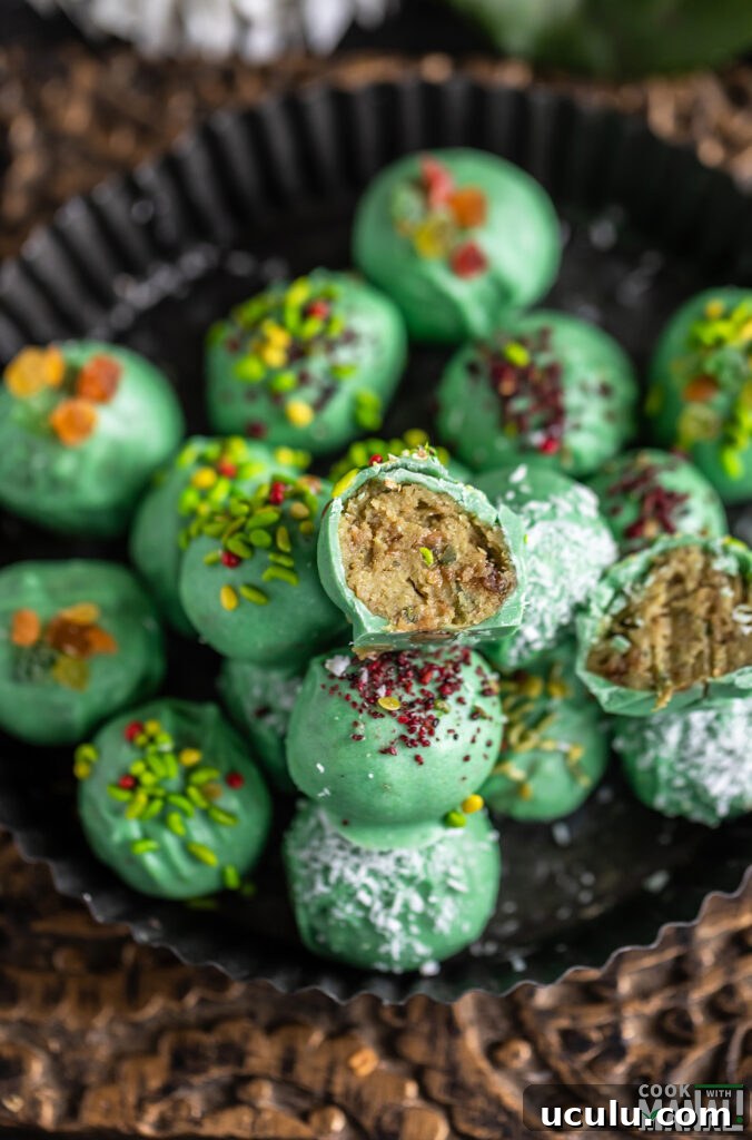 a paan cheesecake truffles cut into half to show the inside