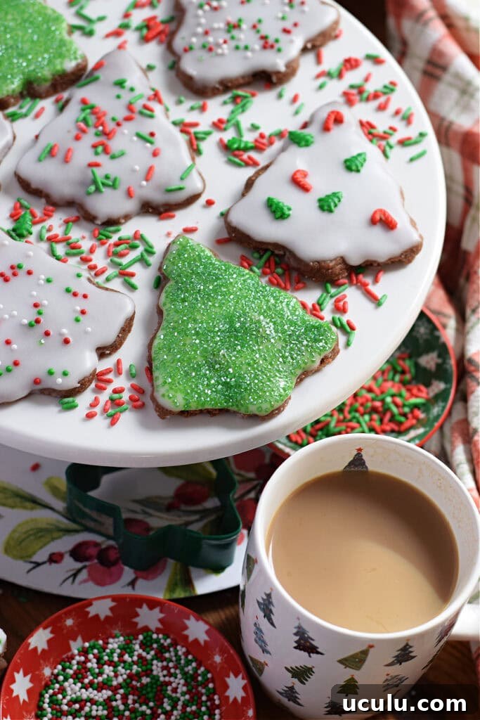 Christmas tree shortbread on a white plate.
