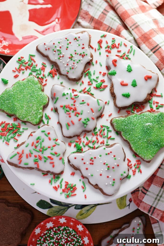 Christmas tree shortbread on a white plate.