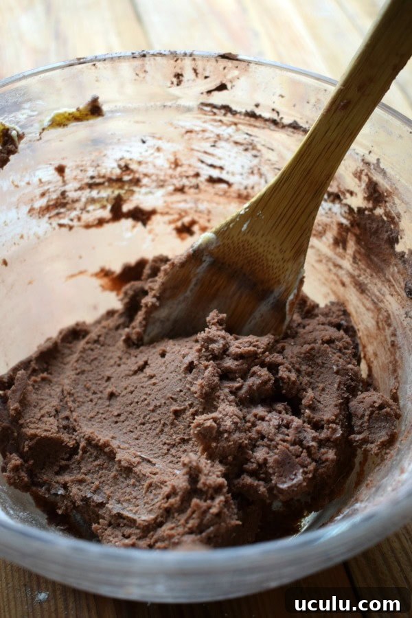 Chocolate shortbread cookies in a glass bowl.