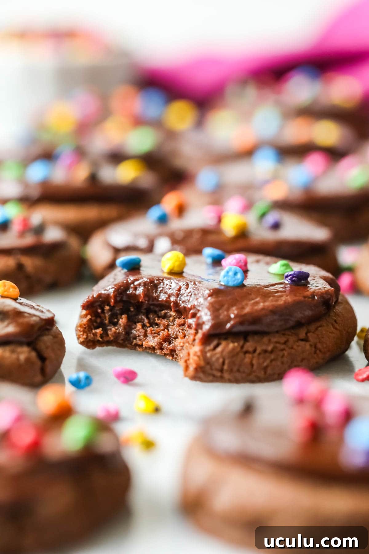 Chocolate cookies topped with fudge frosting and colored candy chips to look like cosmic brownies.