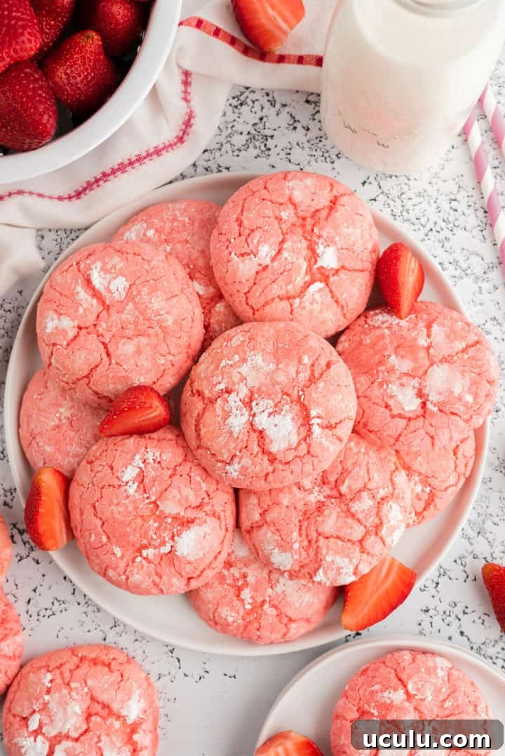 Top down view of a plate of strawberry cookies.