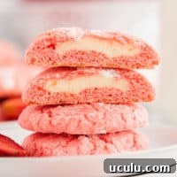 Strawberry cake mix cookies in a stack.