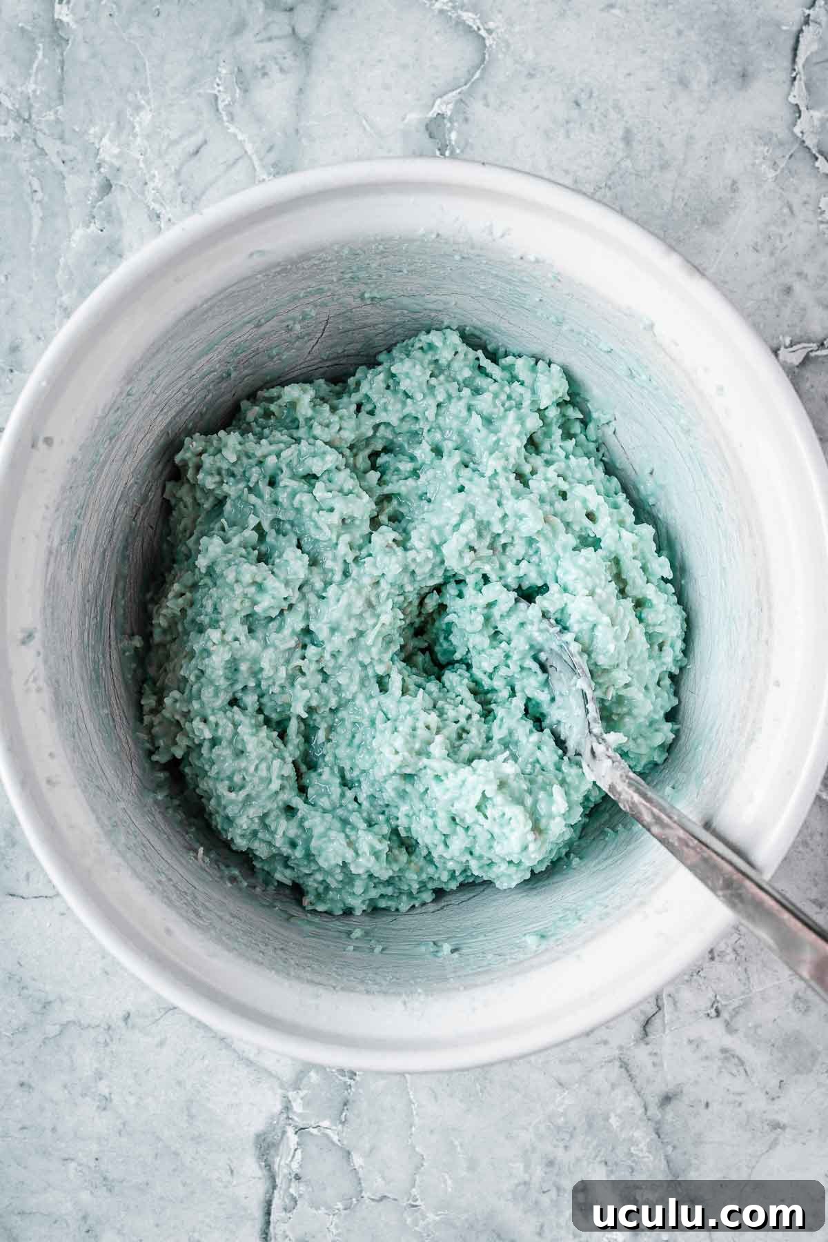Blue coconut ice after being mixed with food coloring.