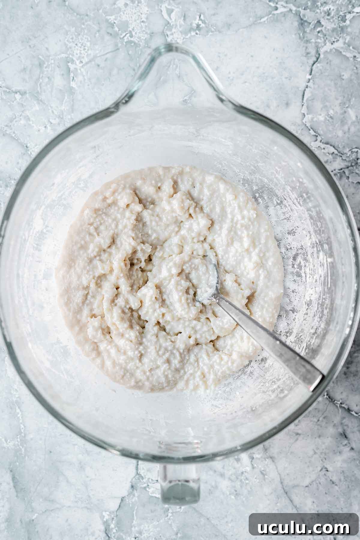 Coconut ice mixture in a mixing bowl.