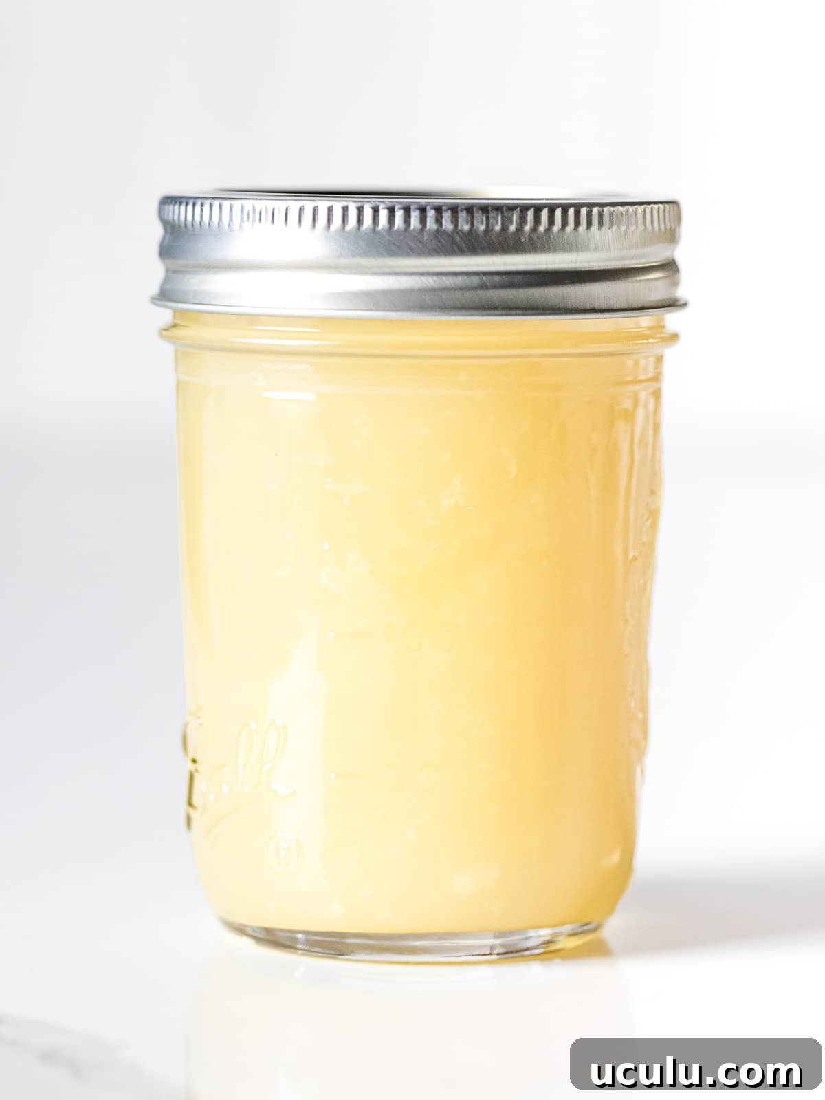Chinese white stir fry sauce in a glass mason jar with lid