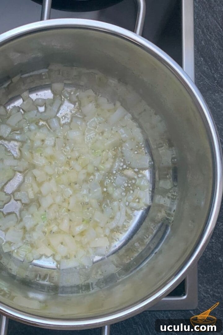 Heat the butter and sauté the onion until translucent.