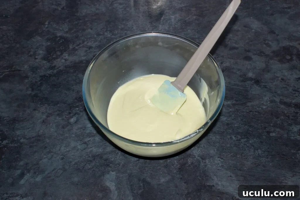 Melted white chocolate in a bowl.