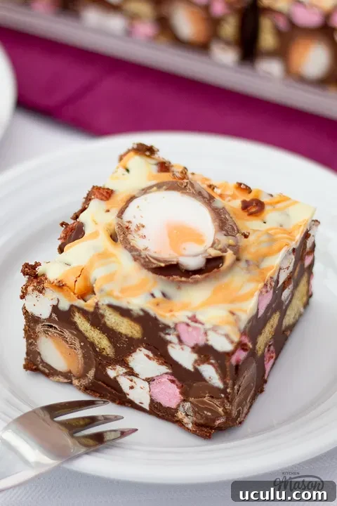 A large bar of Creme Egg rocky road on a white plate.