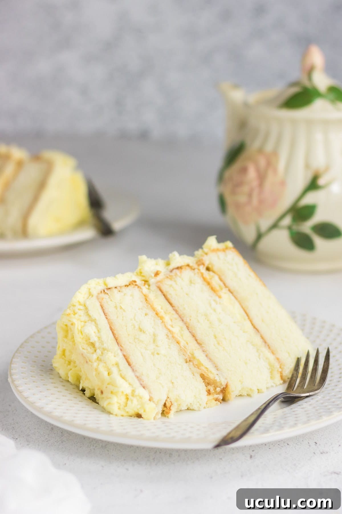 A slice of buttermilk layer cake on a plate.
