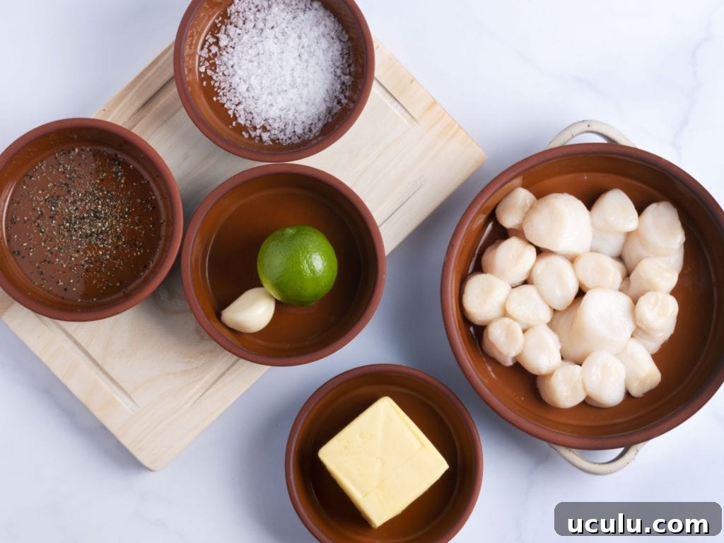 ingredients in bowls: raw scallops, lime, butter, salt and pepper
