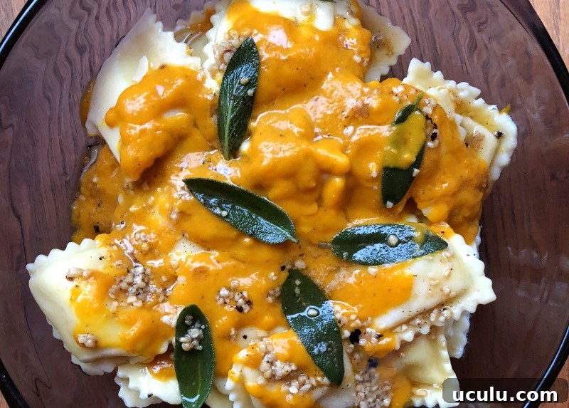 Pumpkin sauce with sage leaves in brown butter over cheese ravioli from ApronFreeCooking