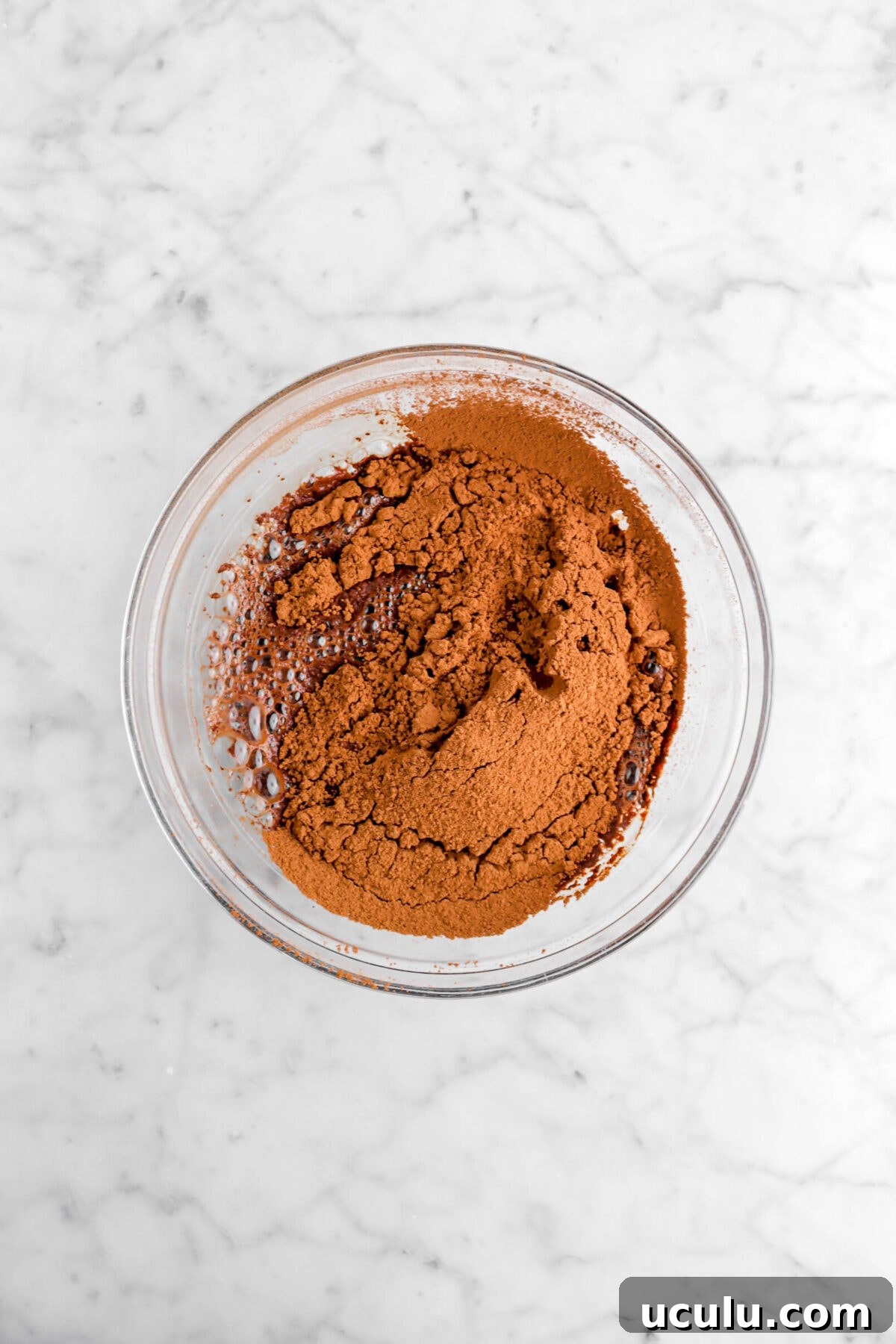 cocoa powder and water on marble counter