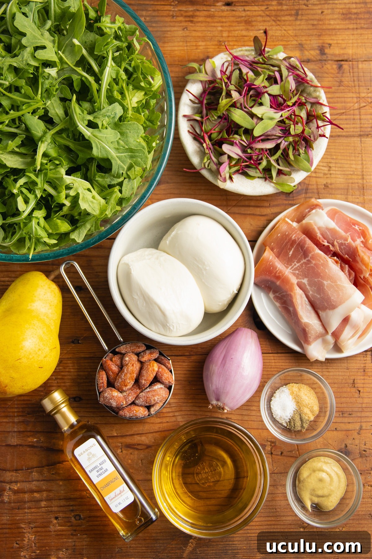 This is a picture of all the ingredients used to make this arugula burrata prosciutto salad.