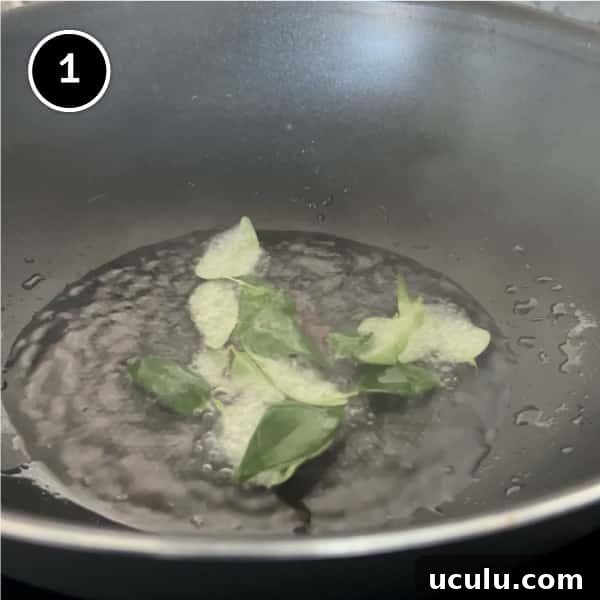Curry leaves spluttering in coconut oil